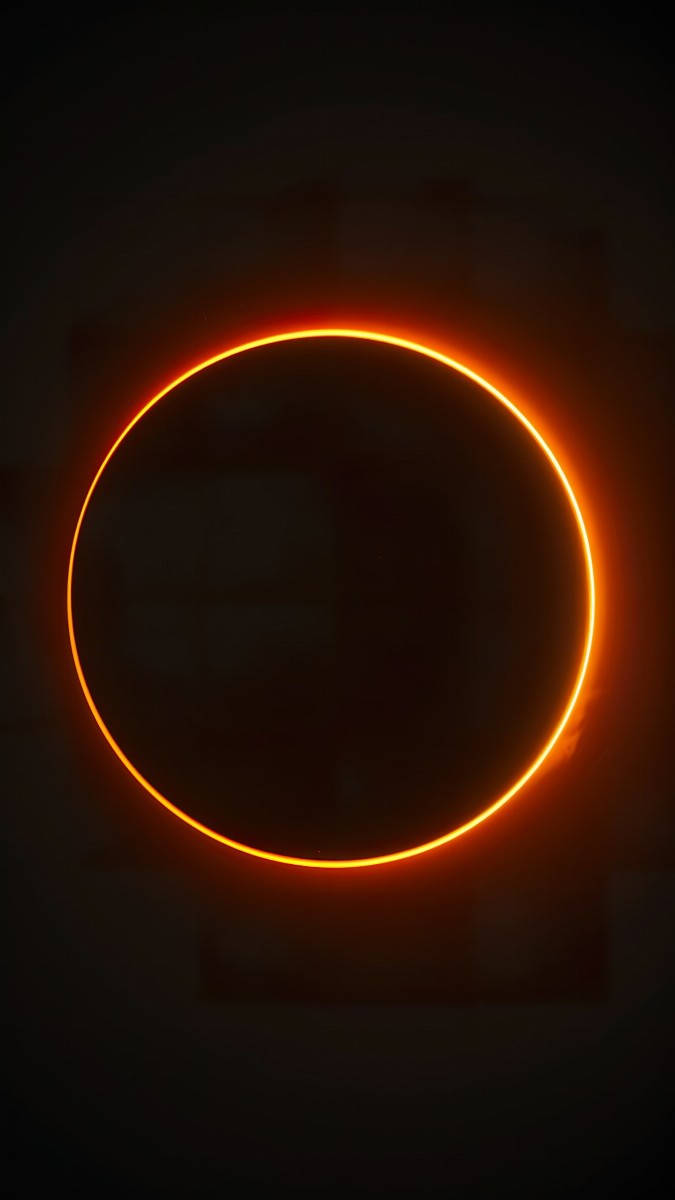 Glowing tangerine circle on a black background