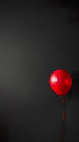 Minimalist Cherry Red Balloon on Pure Black Background Wallpaper
