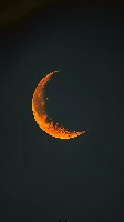 Minimalist Tangerine Orange Crescent on Black Background Wallpaper
